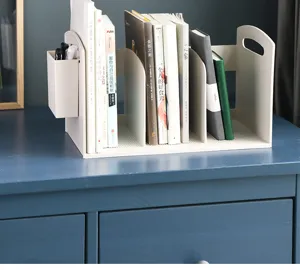 Detailed view of desktop plastic multi-grid book organizer with a small side pen holder.