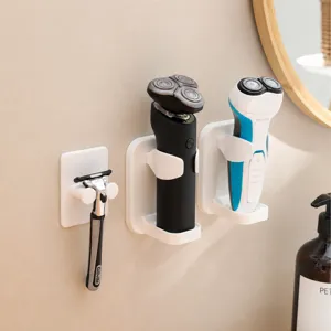 Wall-mounted razor holder, punch-free bathroom organizer for manual and electric shavers.