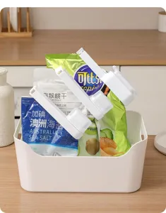 Versatile plastic food sealing clip with pouring spout for kitchen snack bag storage and freshness.