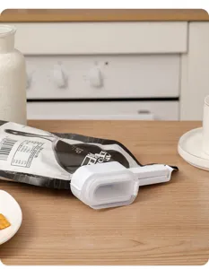 Plastic food sealing clip with pour spout and lid for fresh snack storage kitchen tool.