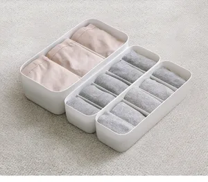 Plastic underwear organizer storage box with compartments for socks and small clothing items.