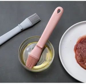 Silicone oil brush detail showing flexible bristles and ergonomic handle for kitchen baking.