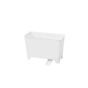 White plastic kitchen sink hanging trash can with drainage spout for food waste filtration