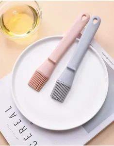 Silicone pastry brush detail showing dual color options, perfect for baking, BBQ, and cooking.