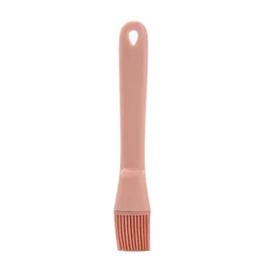 Pink silicone basting brush for cooking, baking, and BBQ, heat-resistant kitchen tool.