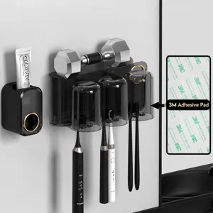 Wall-mounted toothbrush holder set with automatic toothpaste dispenser and magnetic cups.