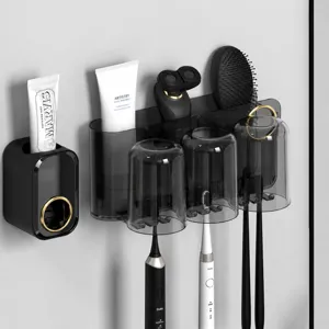 Wall-mounted toothbrush holder with inverted cups and toothpaste dispenser for bathroom.