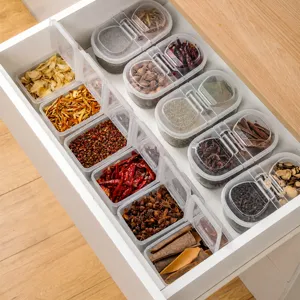 Boîte à épices transparente avec couvercle pour le rangement dans tiroir de cuisine.