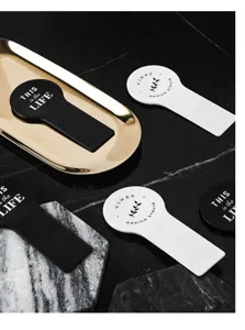 Convenient toilet lid lifter, hygienic handle tool for bathroom seat, clean and practical design.