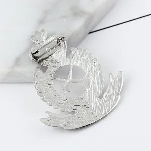 Close-up detail of the vintage silver alloy brooch back with secure pin clasp and intricate design.