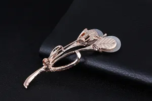 Detailed view of rose gold tulip brooch pin back showing craftsmanship and secure clasp design.
