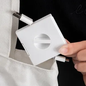 Enrouleur de câble portable avec support de téléphone organisateur de cordon de charge.
