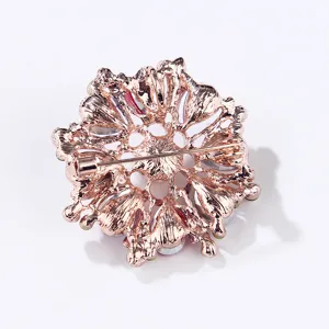 Detailed view of the exquisite rose gold tone crystal pearl alloy brooch pin back.