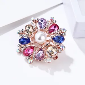 Detailed close-up view of a sparkling multi-color crystal pearl flower brooch pin.