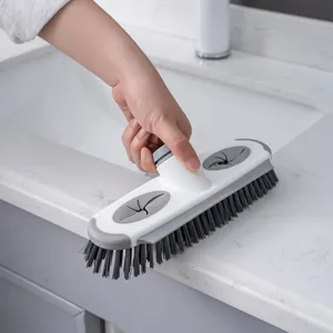 Household multi-functional cleaning brush with scraper for bathroom and kitchen use.