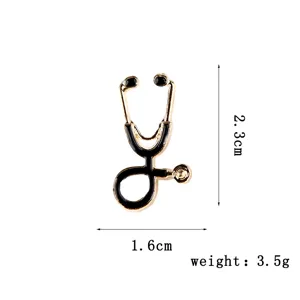 Minimalist stethoscope alloy brooch, elegant black and gold medical pin for women.