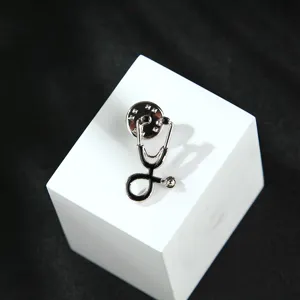 Elegant alloy stethoscope brooch pin for women, stylish student accessory and fashion jewelry.