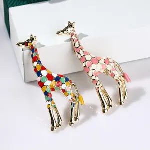 Detailed view of colorful enamel giraffe brooches, stylish alloy pin for cardigans and scarves.