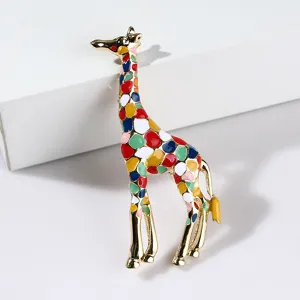 Close-up of a colorful enamel giraffe brooch with gold-toned metal detailing for daily wear.