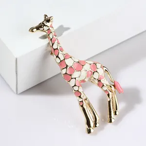 Exquisite pink and white enamel giraffe brooch, detailed metal craft, elegant accessory.