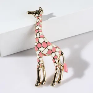 Elegant enamel giraffe brooch, gold-tone metal with pink and white details, stylish accessory.