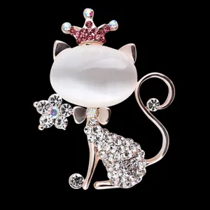 Exquisite rhinestone crown kitten cat eye brooch detail, elegant rose gold finish sparkle.