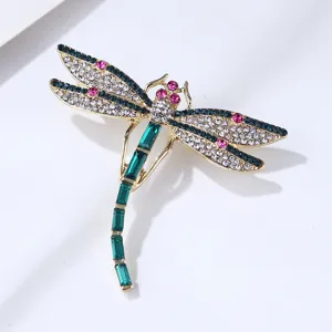 Exquisite crystal dragonfly brooch detail, gold-tone alloy rhinestone pin for elegant outfits.