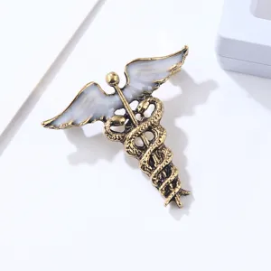 Broche vintage de aleación dorada con serpiente alas de ángel pasador médico retro moda