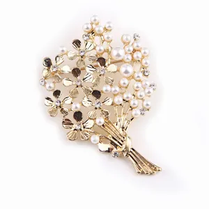 Exquisite floral bouquet brooch detail featuring elegant pearls and sparkling rhinestones.
