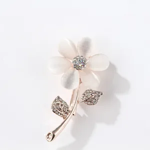 Elegant rhinestone cat eye stone flower brooch, sweet rose gold alloy fashion accessory.