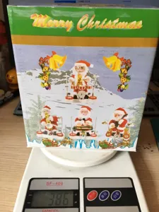 Weihnachten elektrischer Weihnachtsmann Spielzeug Verpackung Box Detailansicht mit Musikfunktionen.