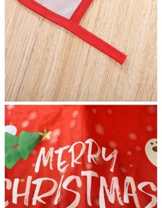Close up detail of red Christmas tree skirt with mesh edge and festive text print.