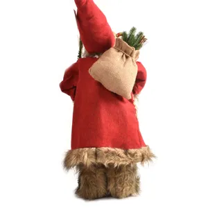 Weihnachtsmann Puppe Figur Dekoration mit rotem Mantel und Geschenksack fuer Feiertage