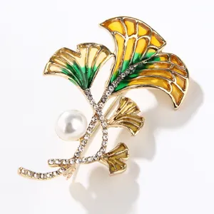 Exquisite ginkgo leaf brooch detail, featuring sparkling zircons and pearl, elegant fashion jewelry.