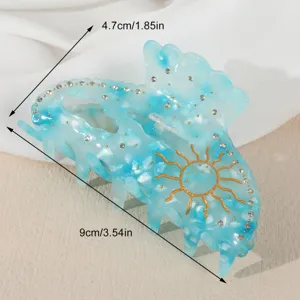 Molletta per capelli in resina blu con strass scintillanti e design del sole d'oro, 9cm.