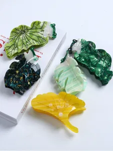 Creative acetic acid hair claw clips featuring cute ginkgo leaf and lotus frog designs for women.