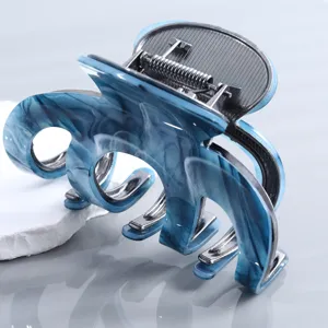 Blaues Marmor Acetat Haarklammer mit Metallfeder, stilvolles Wellen-Design für Damen.