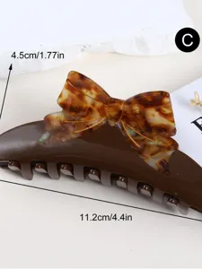 Acetate hair claw clip with stylish tortoise shell bow design for daily elegant hairstyles.