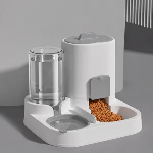 Mangeoire et abreuvoir automatique pour animaux, double gamelle gris et blanc avec séparation.