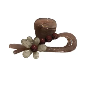 Elegante braune Blumen Haarklammer für Damen, stilvoller mittlerer Haargreifer für Frisuren.