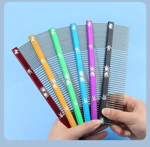 Stainless steel pet grooming comb details, dual pitch teeth, colorful metal handles.