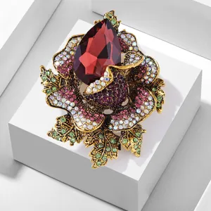 Detailed shot of luxury vintage crystal rose brooch with sparkling colorful rhinestones.
