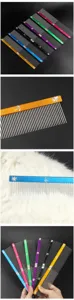 Stainless steel pet grooming comb detail, metal dog detangling tool with engraved spine.