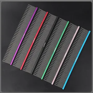 Close-up of colorful pet grooming combs featuring fine metal teeth and vibrant handles.