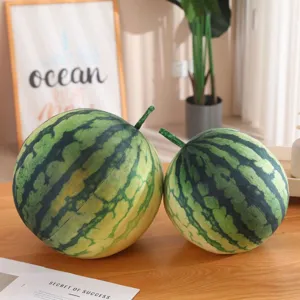 Detailed shot of cute round watermelon plush pillow toys placed on desk, soft and realistic.
