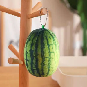 Cute plush watermelon keychain toy, soft stuffed fruit doll pendant for bags and keys.