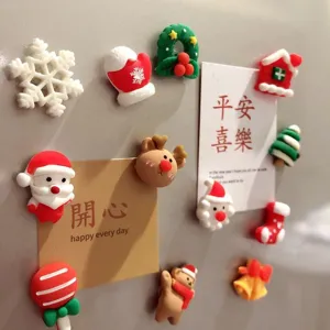 Detailed close up of cute Christmas resin fridge magnets featuring various holiday festive designs.