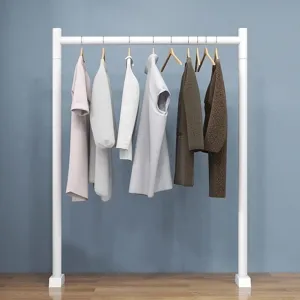 Minimalist white floor-standing clothing rack with wooden hangers for bedroom balcony use.