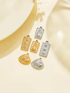 Stainless steel DIY jewelry pendants featuring tarot cards and shell shapes with sparkly rhinestones.