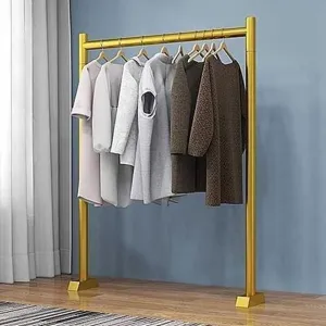 Floor clothes rack for bedroom, gold metal garment stand for small spaces and balcony.